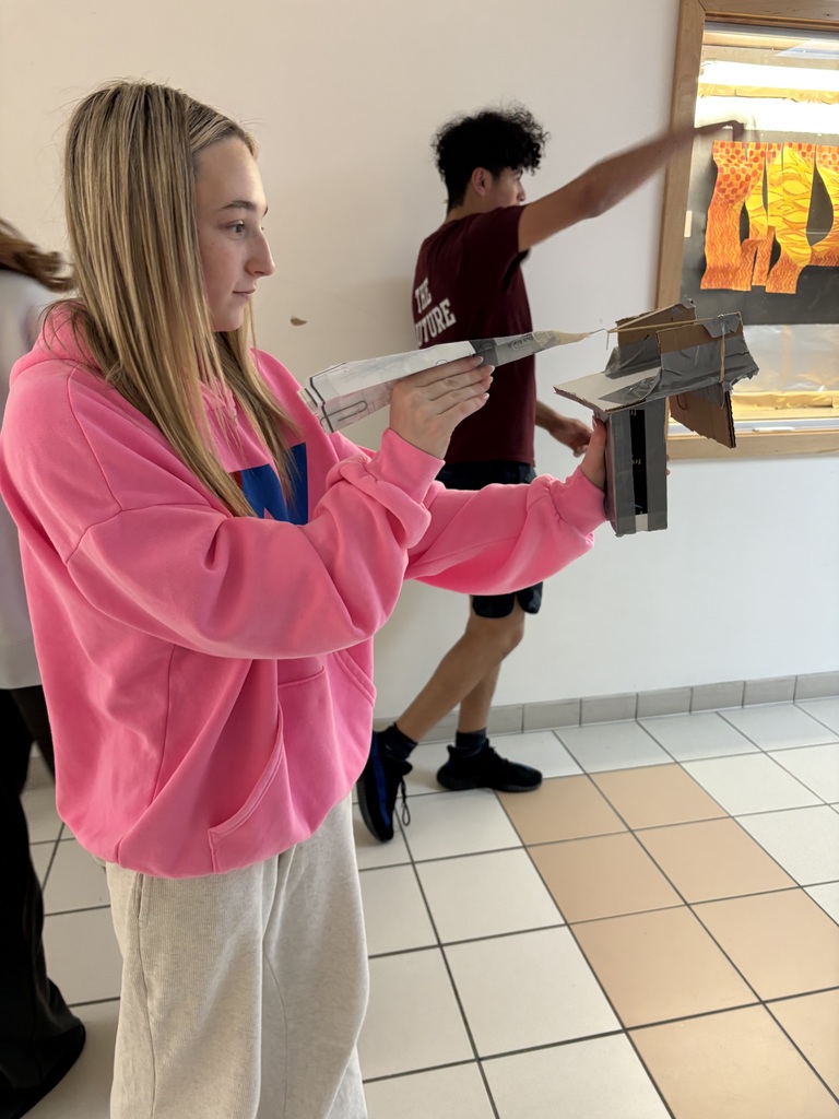 Testing paper airplane launchers in PLTW.