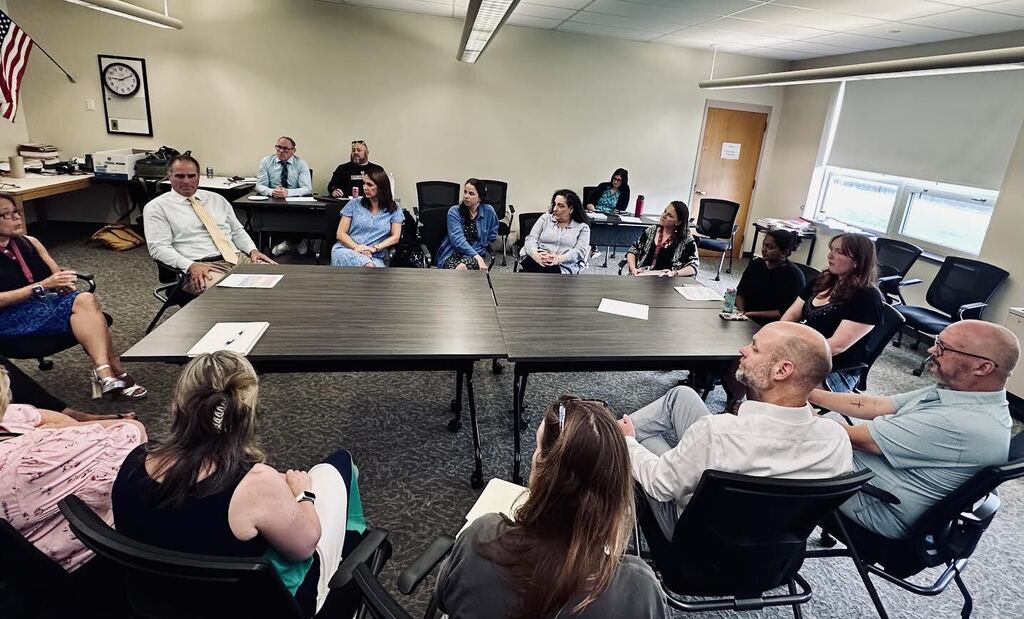 students leading a meeting