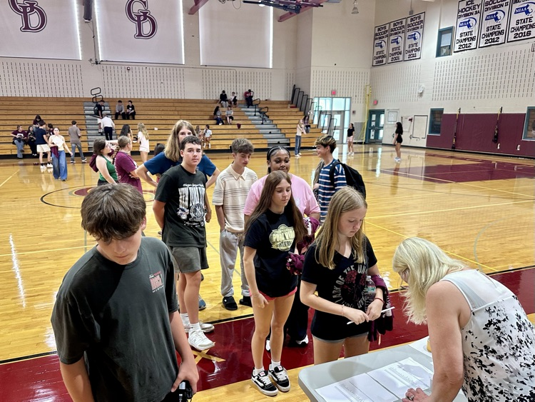 students collect their chromebook