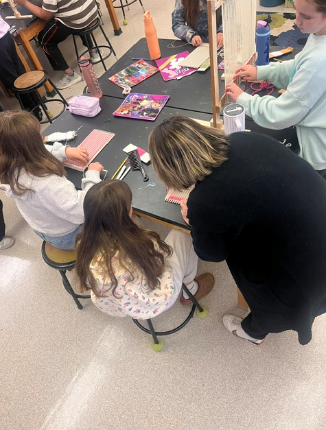 Students working on looms in Art Class