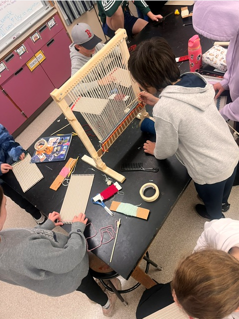 Students working on looms in Art Class