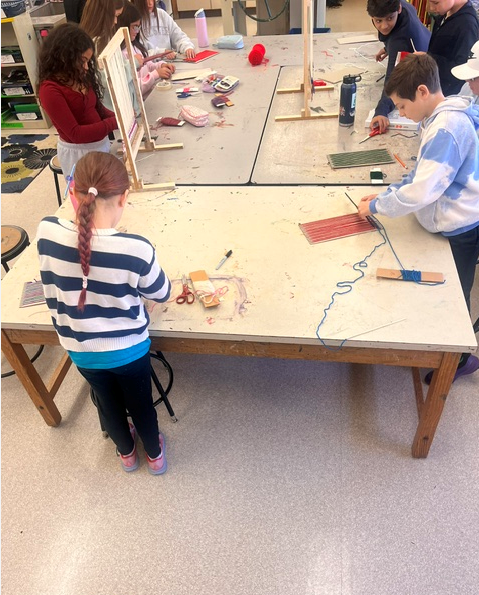 Students working on looms in Art Class
