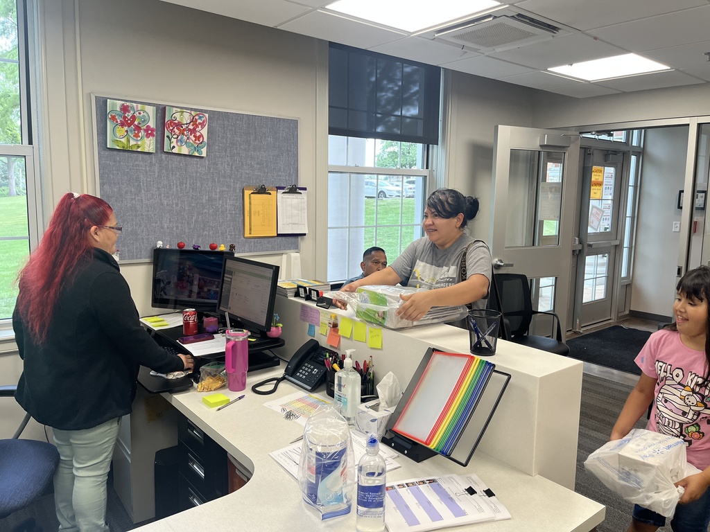Front desk staff and parent
