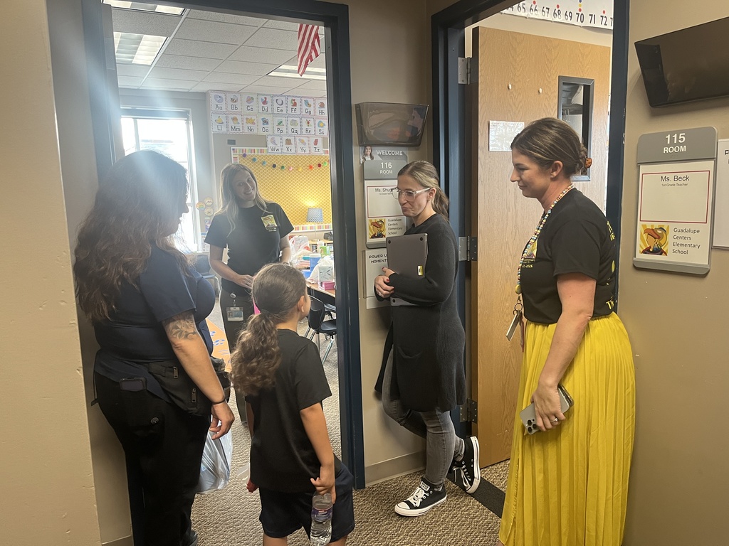 Teachers meeting in the hallway