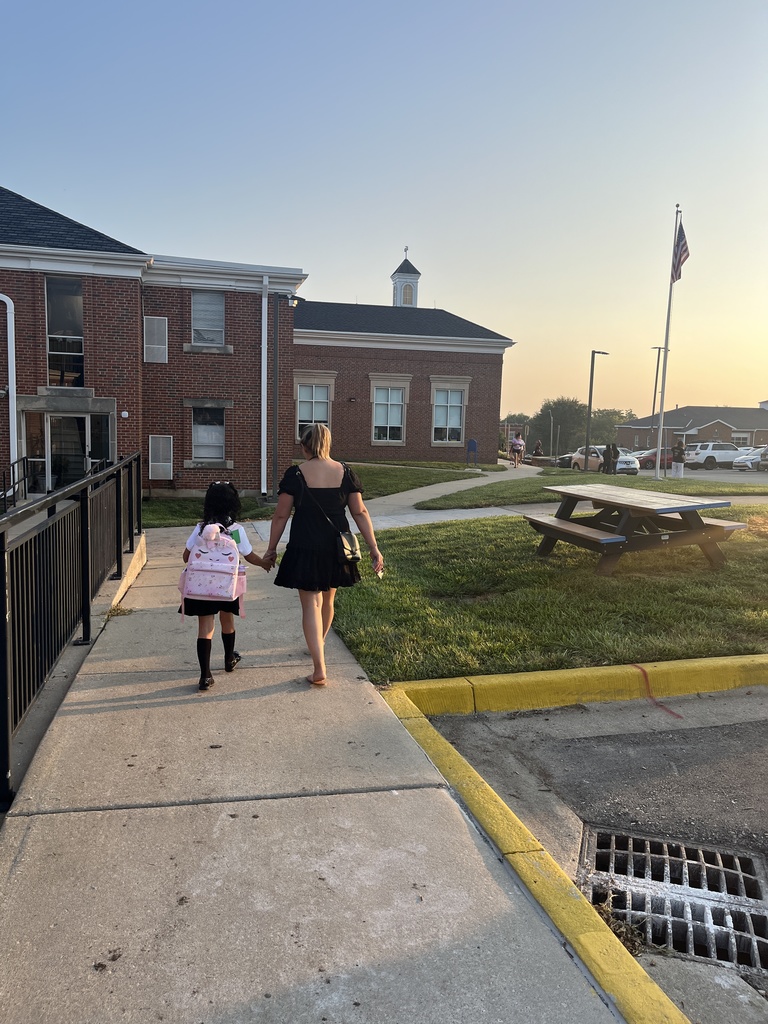 Student and mom walking to school