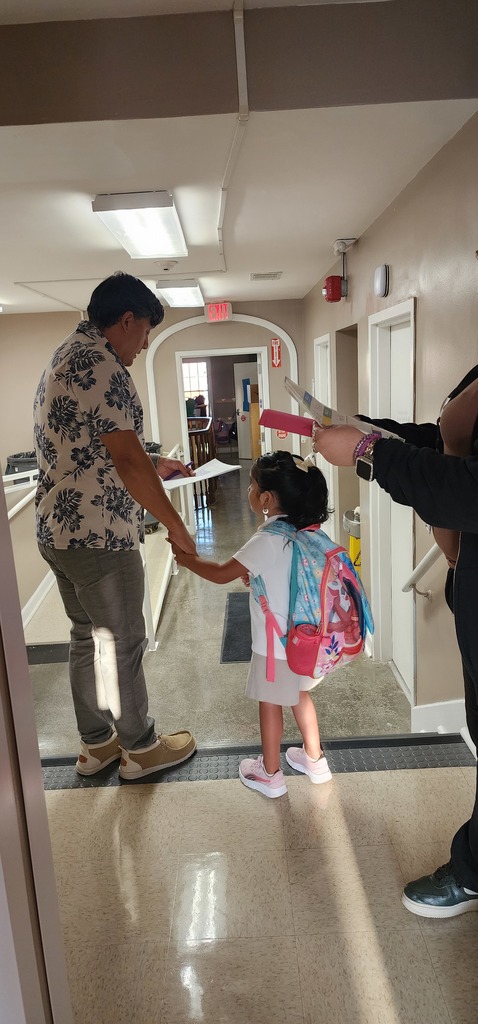 educator accompanying student to his classroom