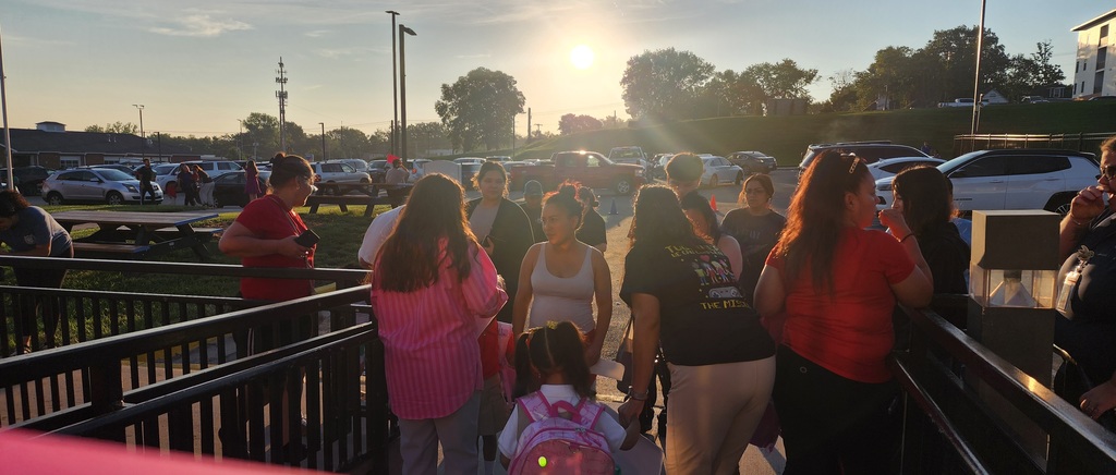 families arriving on the first day of school