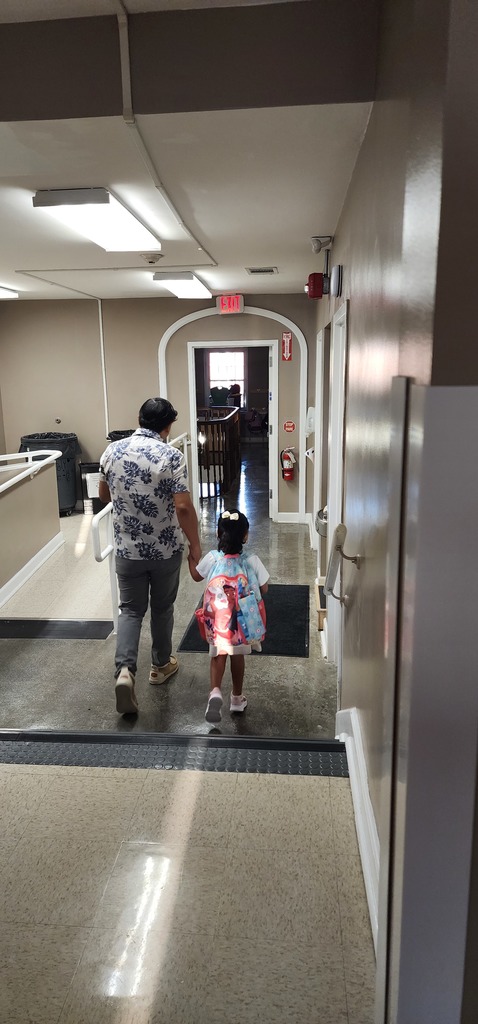 educator accompanying student to his classroom
