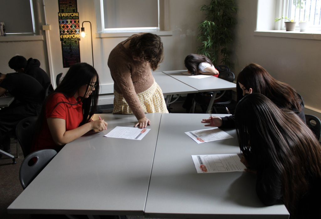 teacher helping student