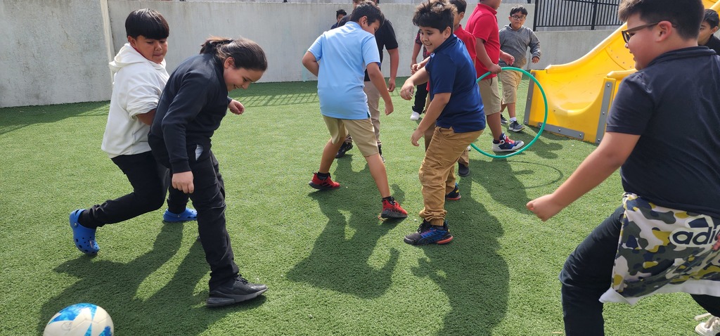 boys  playing futbol soccer