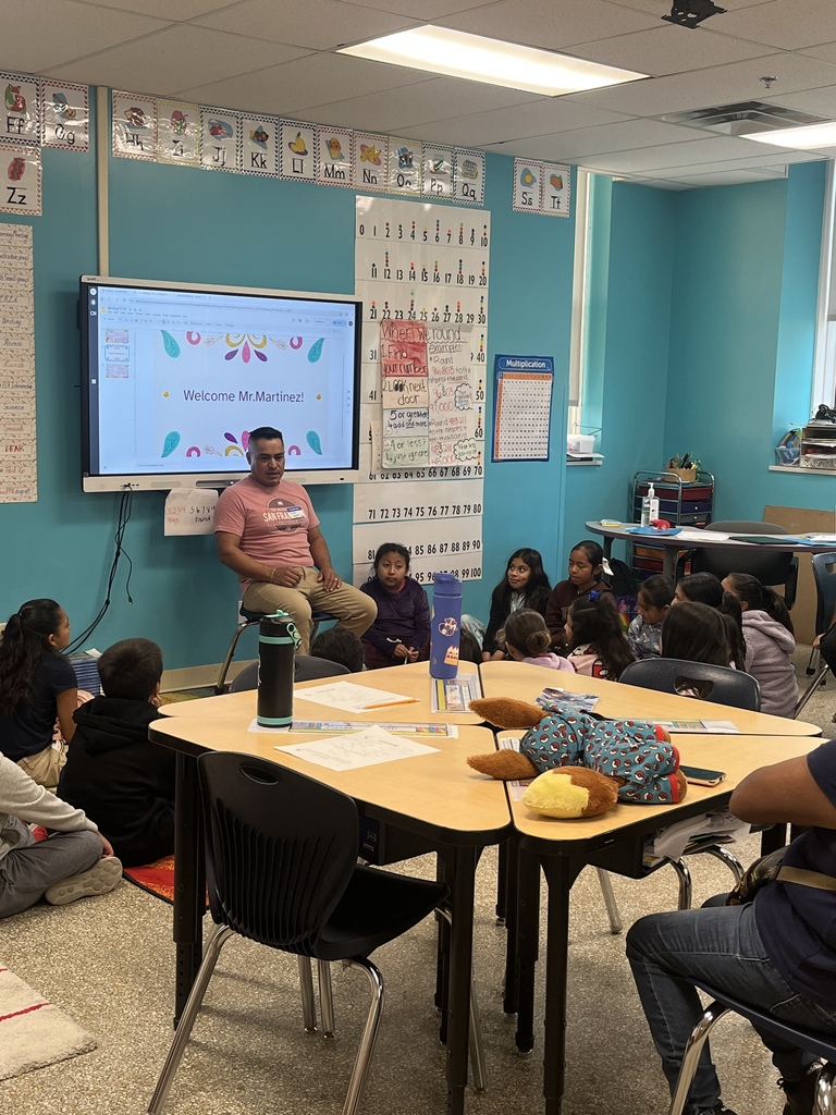 Parent telling a story in the classroom.