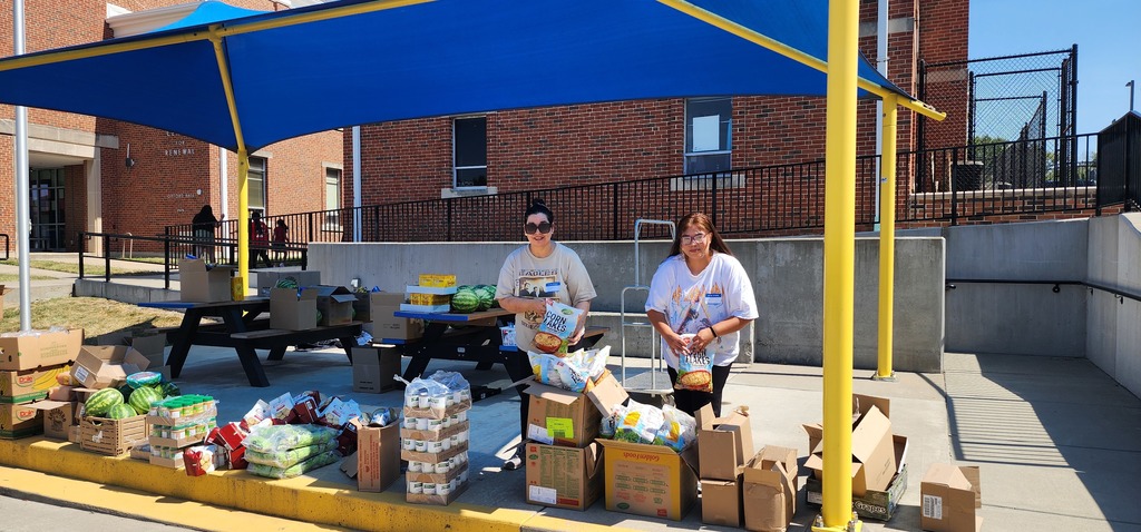 Volunteers helping distribute food pantry items
