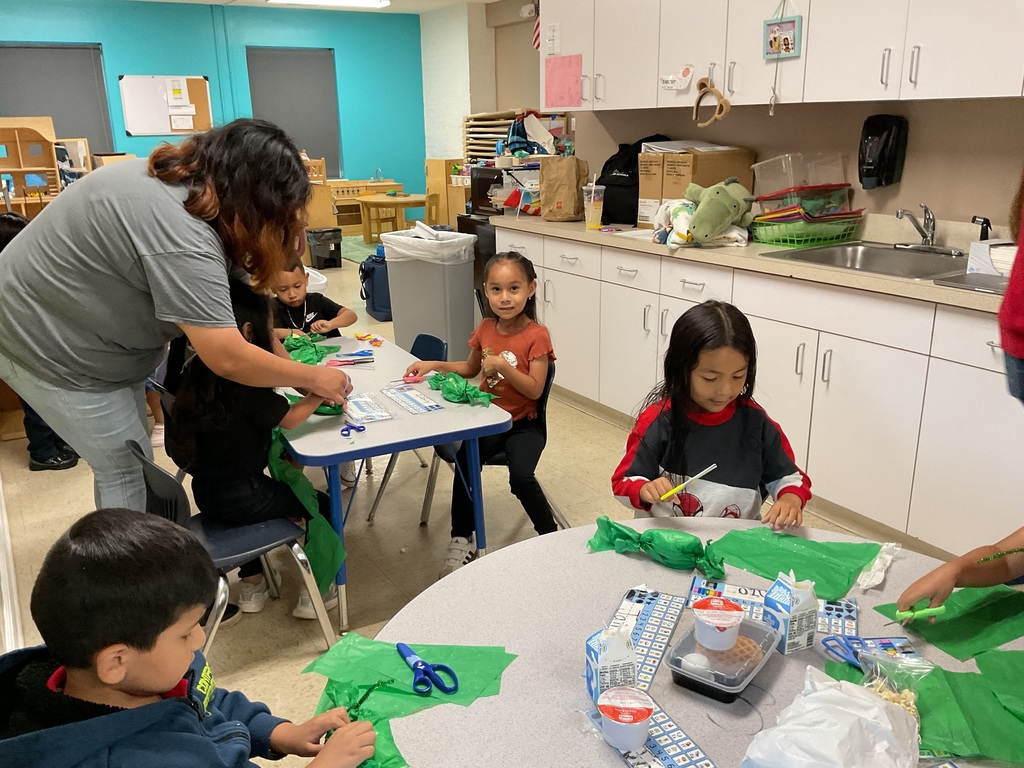 Mom doing a craft in her son's class.