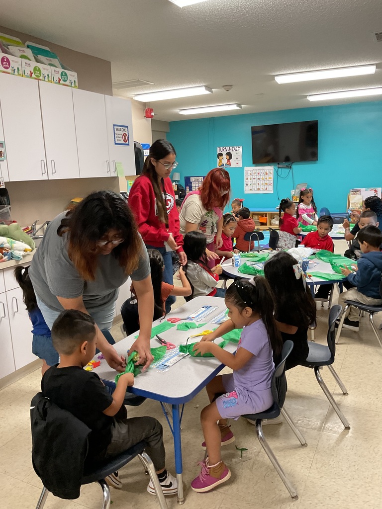 Mom doing a craft in her son's class.
