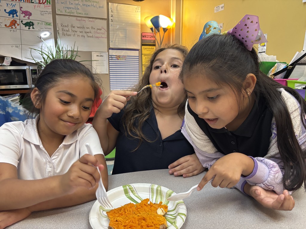 Students eating yams 