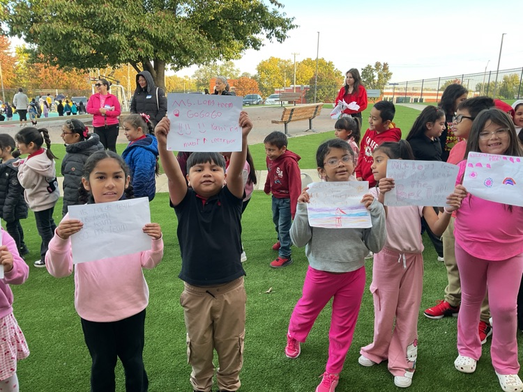 kids holding signs for the Olympics