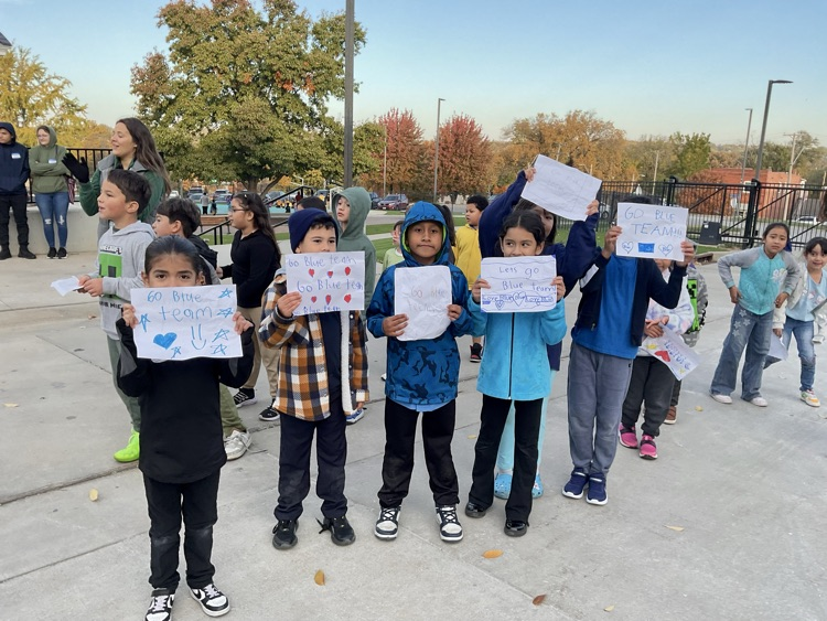 Olympics kids holding sign