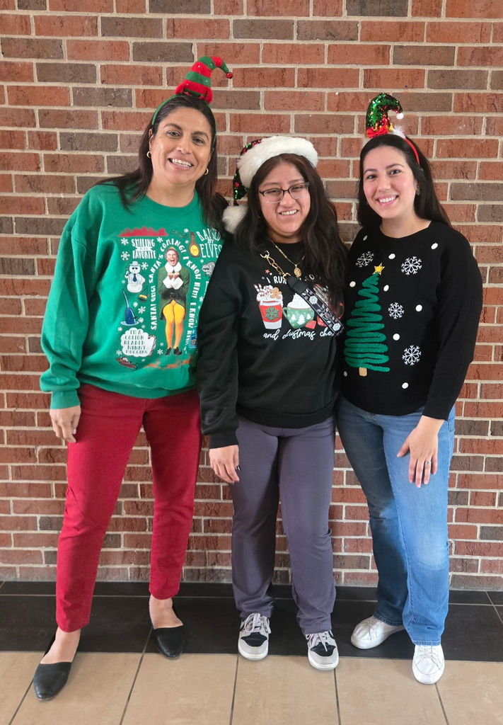 School staff during Spirit Week dressed in their favorite festive outfit