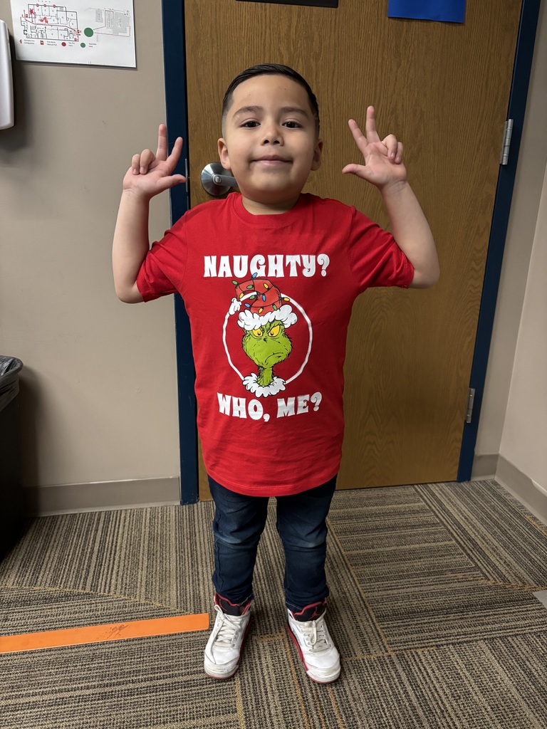 Kid showing off school spirit wearing white and red