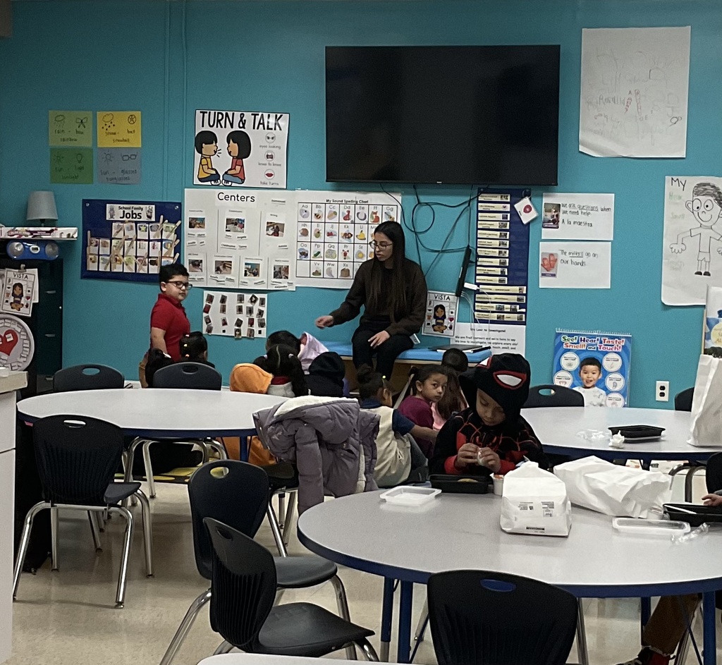 eacher with her students in the classroom.