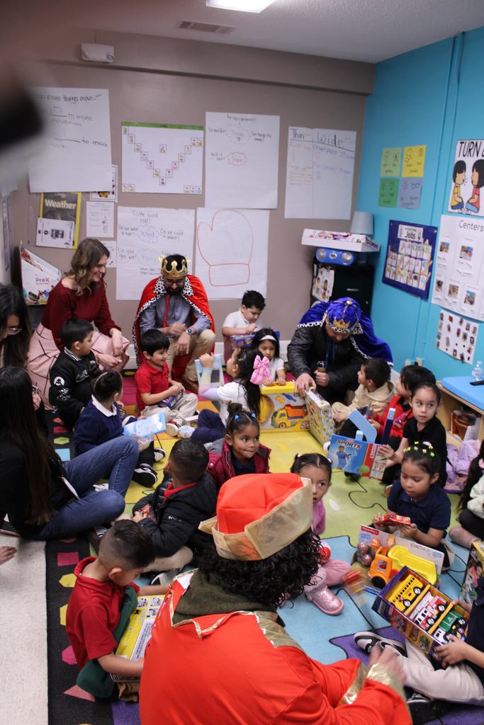 Children enjoying a day where they were given a toy