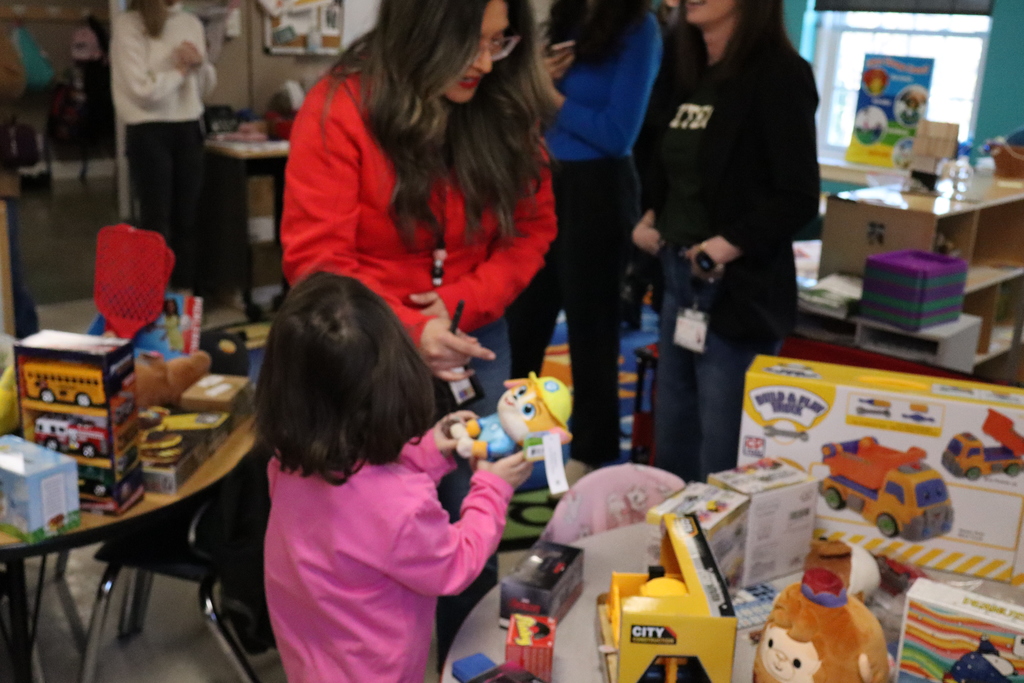 Children enjoying a day where they were given a toy