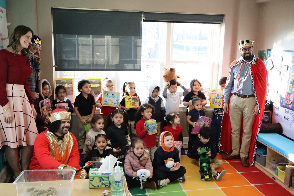 Children enjoying a day where they were given a toy
