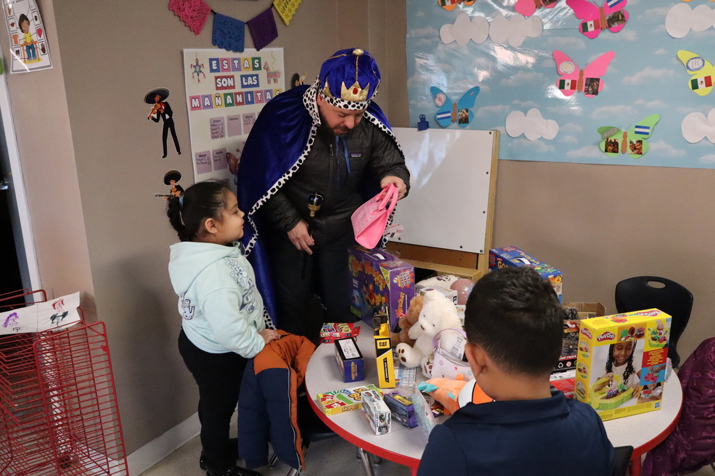 Children enjoying a day where they were given a toy