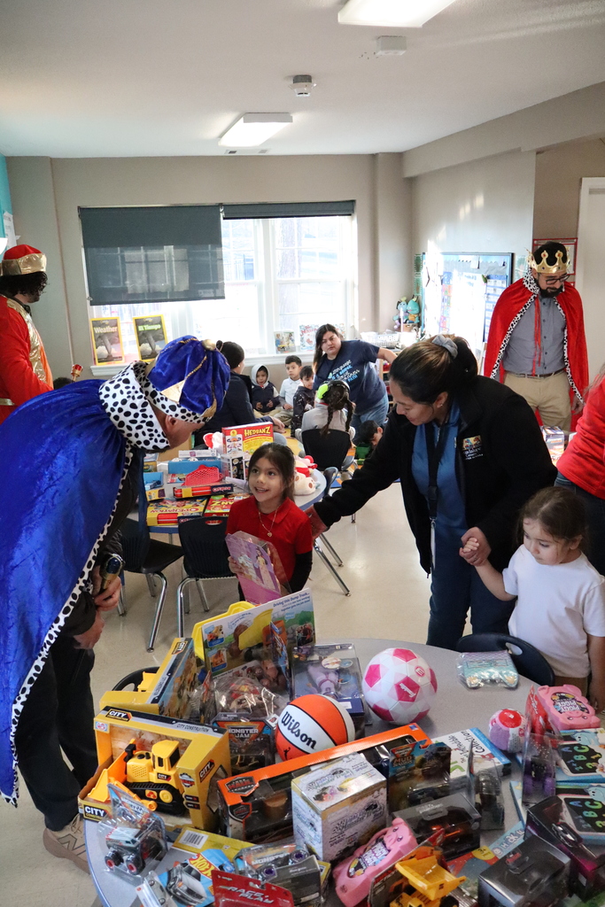 Children enjoying a day where they were given a toy