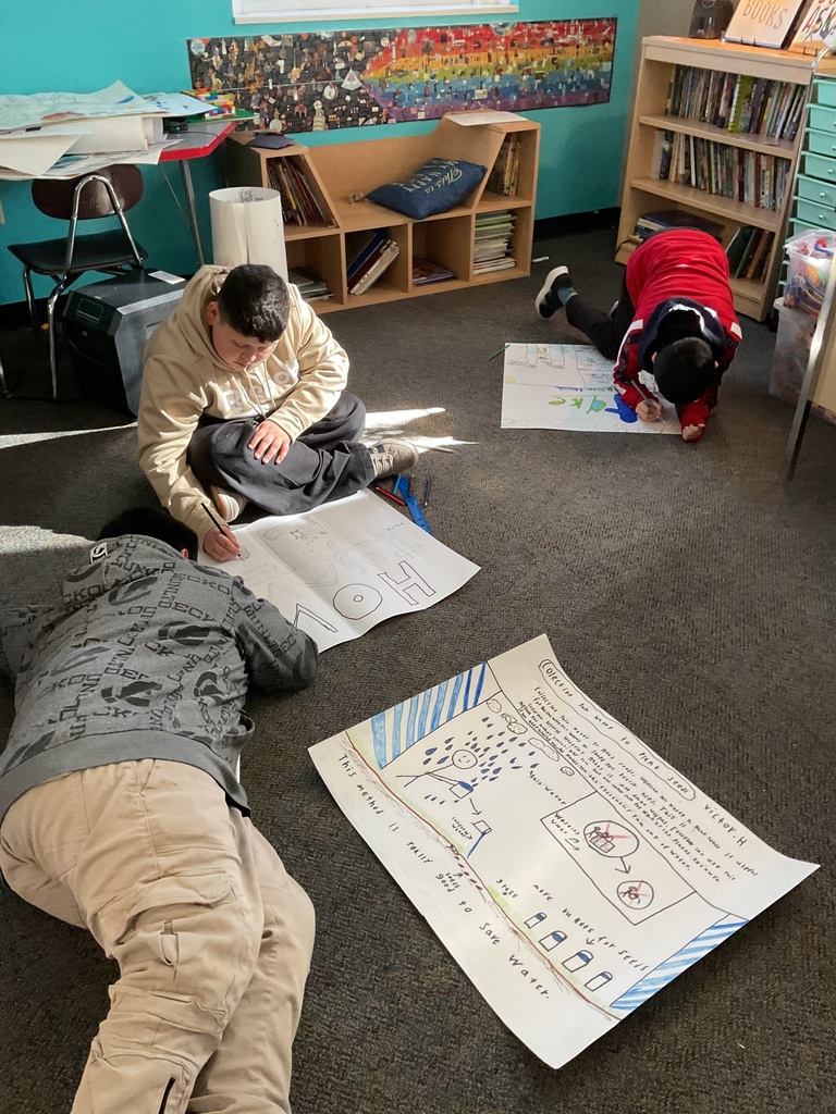 Students working on their poster