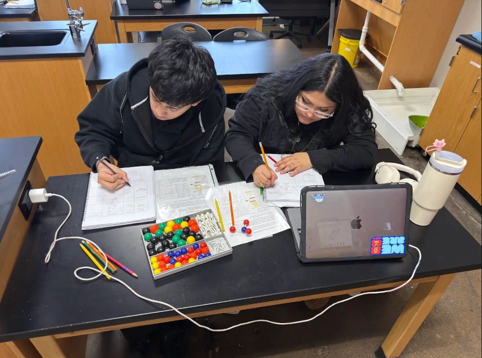 group of students looking at notes