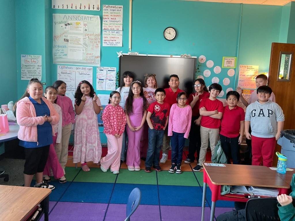 Forth grade group celebrating the Friendship Party dressed in pink and red