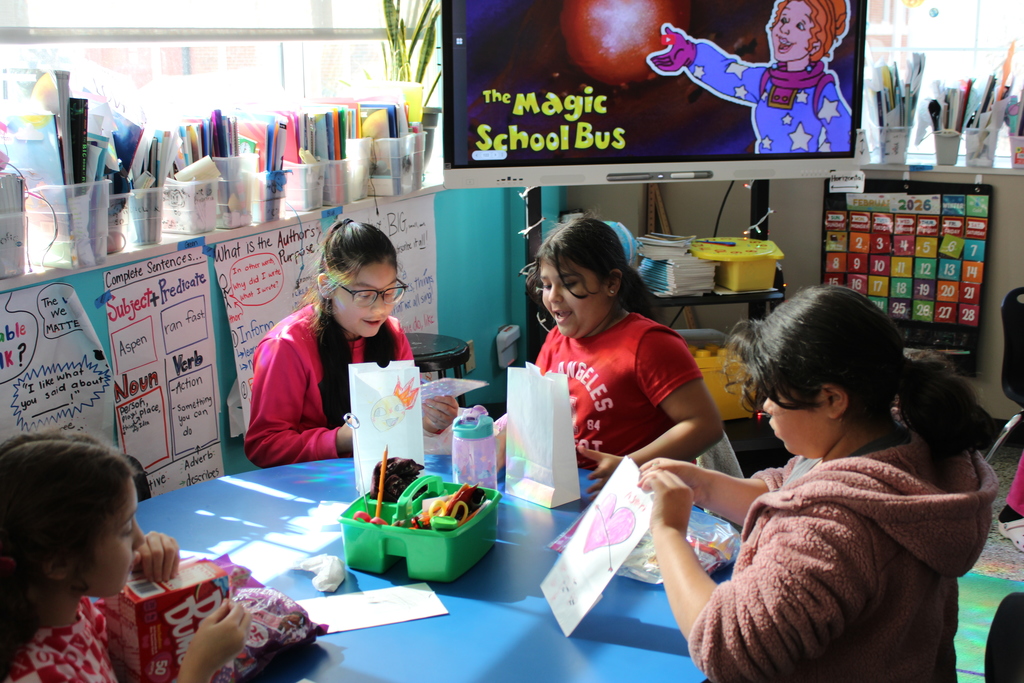 Third grade students making a craft during the Friendship Party celebration in their classroom