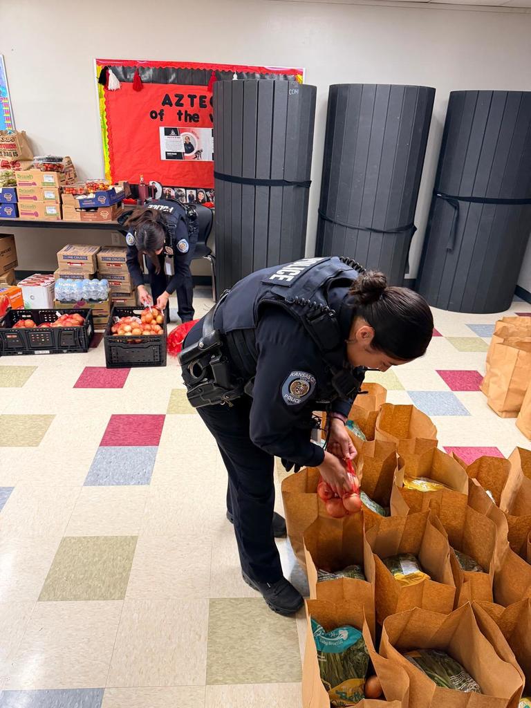 two officers sorting food