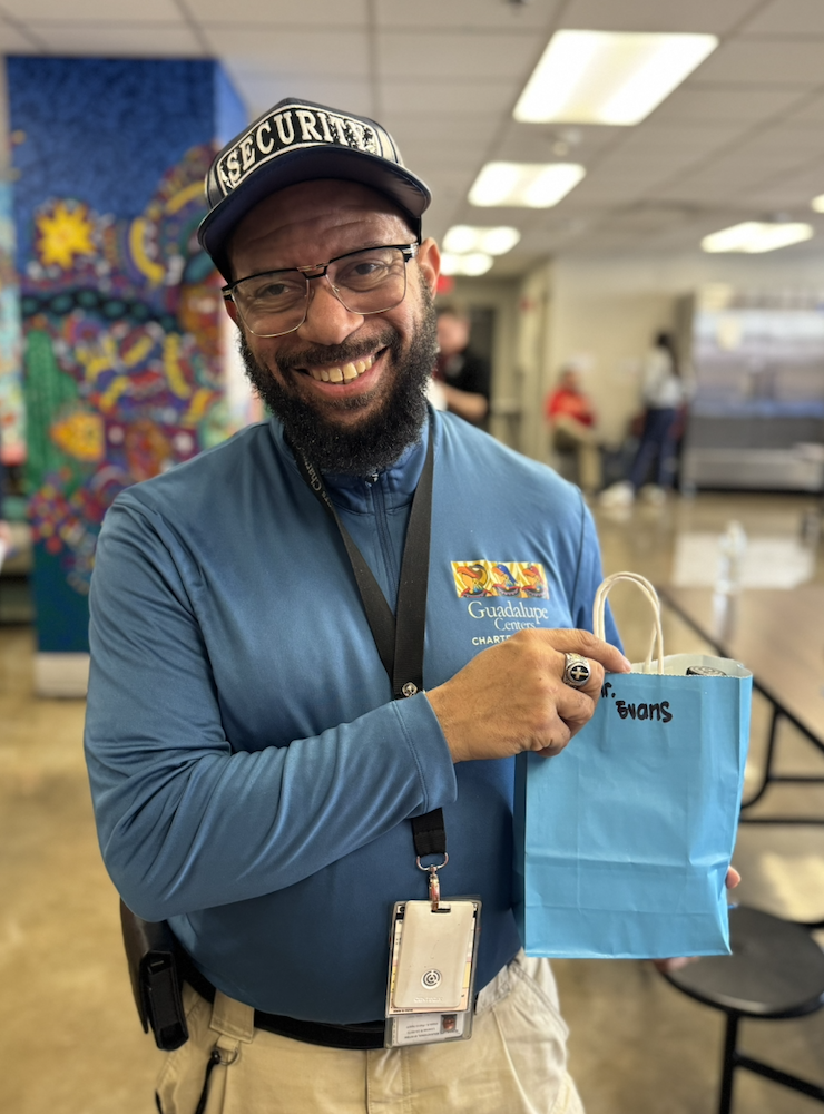Mr. Evans holding his gift