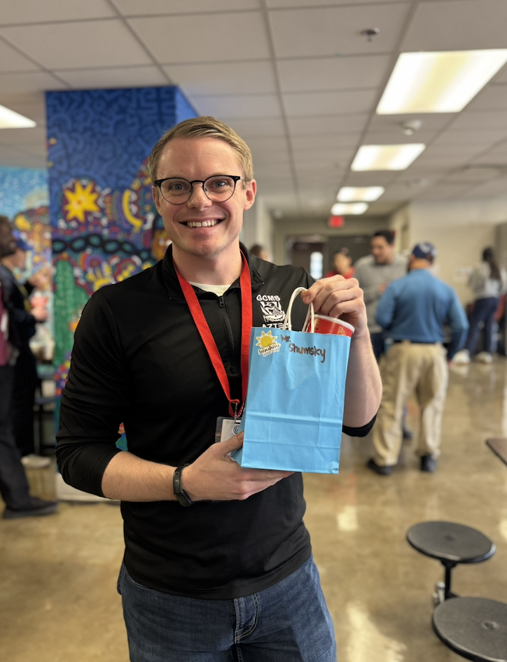 Mr. Shumsky holding his gift