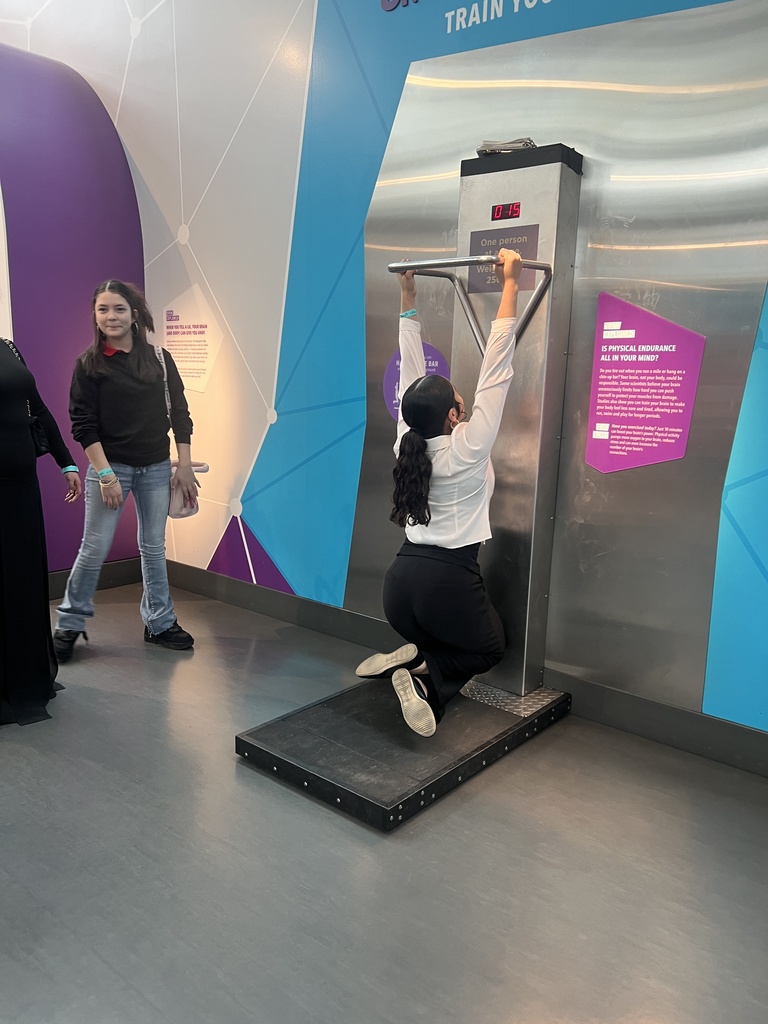 student trying out at the science city machine