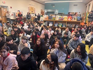 Picture of students sitting down in the library