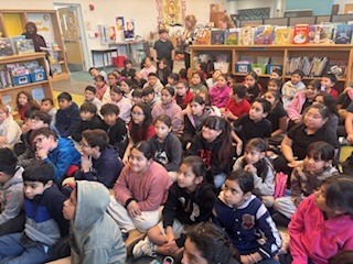 Picture of students sittiling down in the library