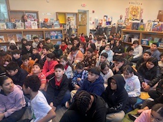 Picture of students sitting down in the library