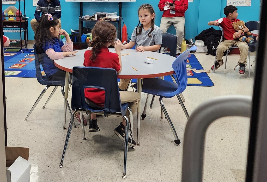 The Gardening Club in a class, learning about gardening.