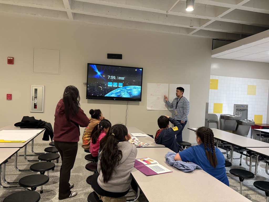 School therapist explaining on the board to students