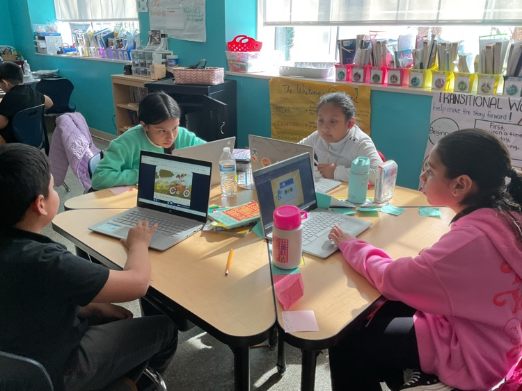 students sitting and exploring a digital library