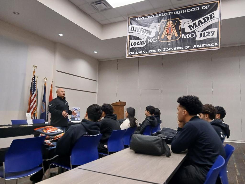 group of students listening to a presentation. 