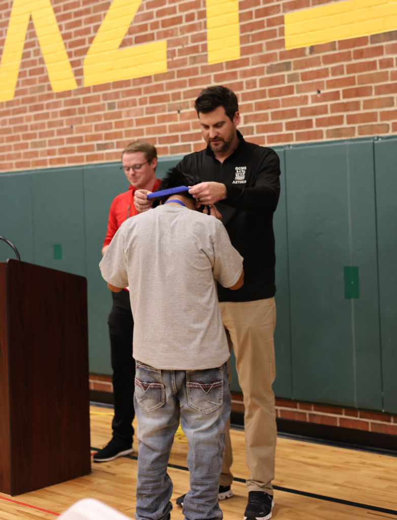Sports Banquet: Student getting a medal