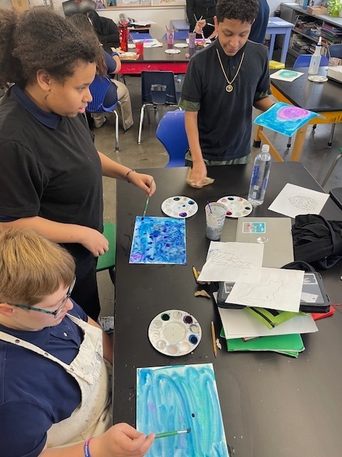 students painting in Dr. Wright's class