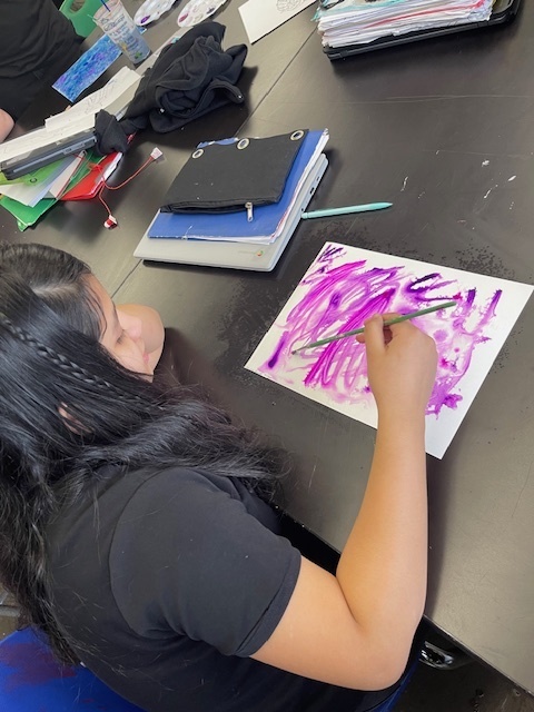 student creating a masterpiece