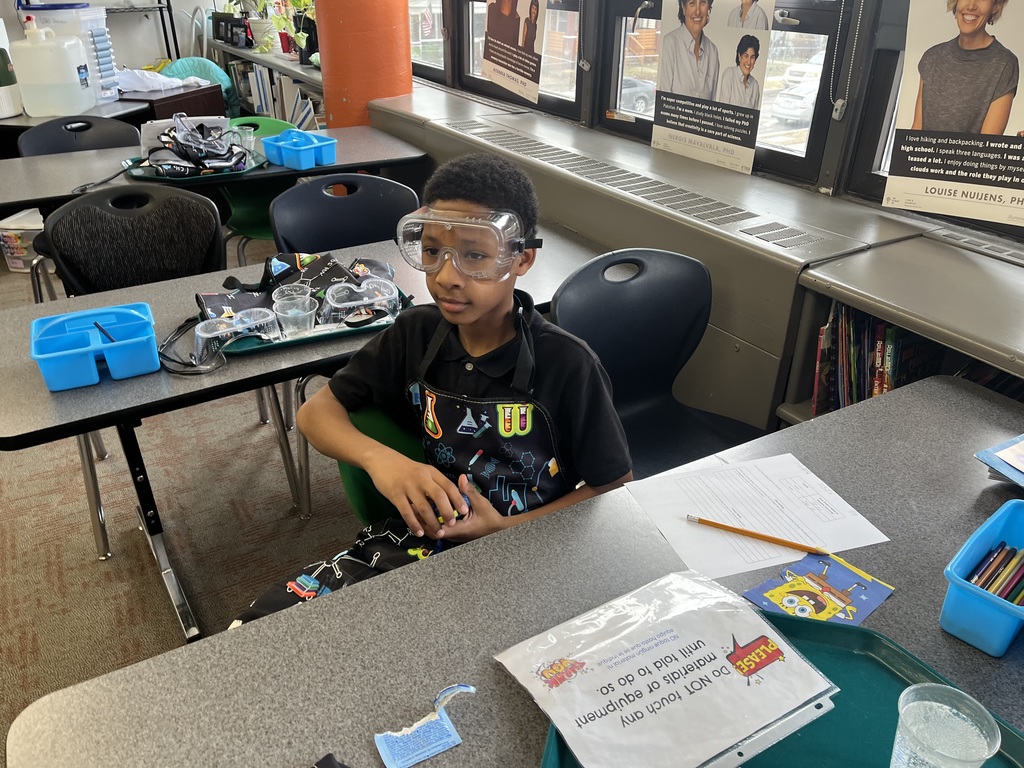 student wearing goggles in science class