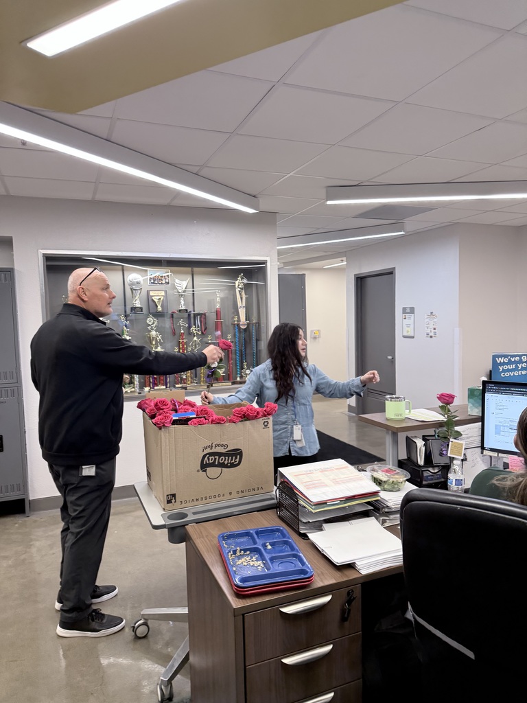 Mr. Woods passing out the roses for our women staff