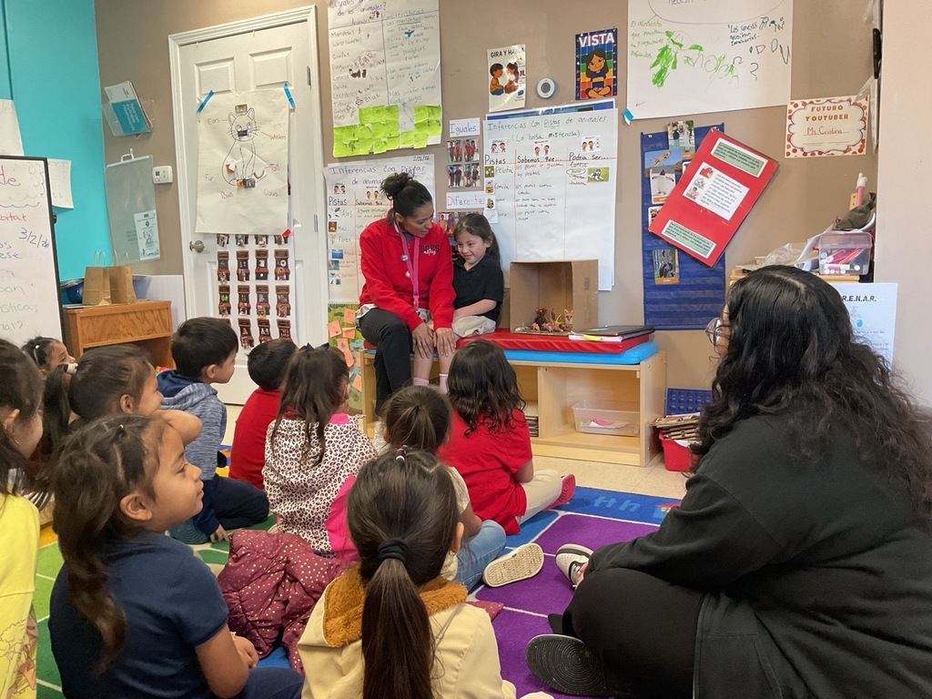 A Pre-K student, with her teacher, shared what she learned about foxes.